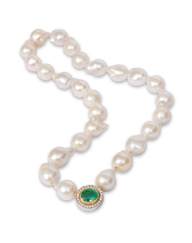 A Baroque Southsea pearl necklace with an emerald diamond clasp