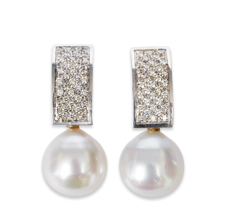 A pair of platinum earrings with southsea pearls and diamonds