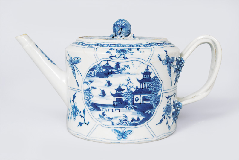 A teapot with landscape in blue painting