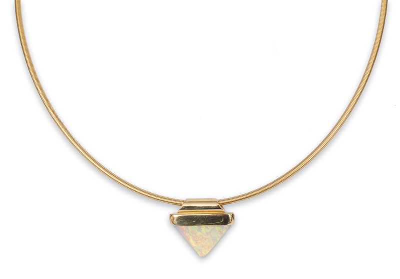 A modern gold necklace with an opal pendant