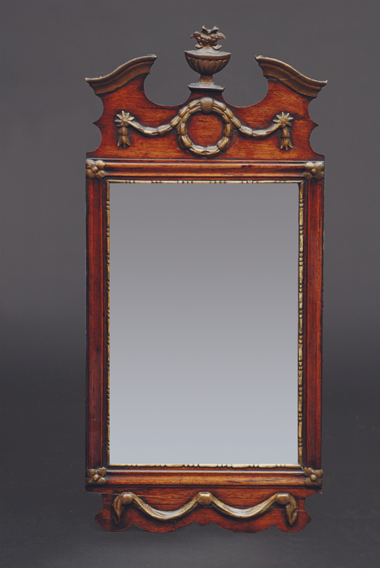 A louis-seize miror with ornament of vase