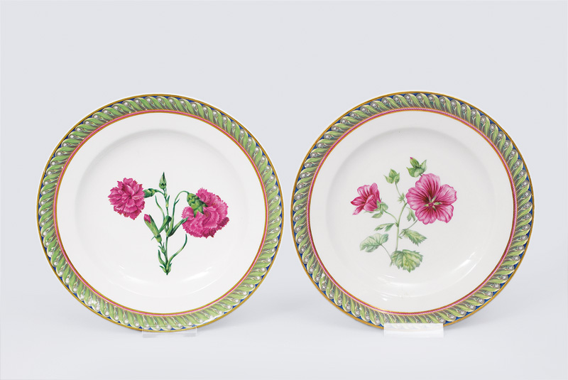 A pair of plates with pink flower painting