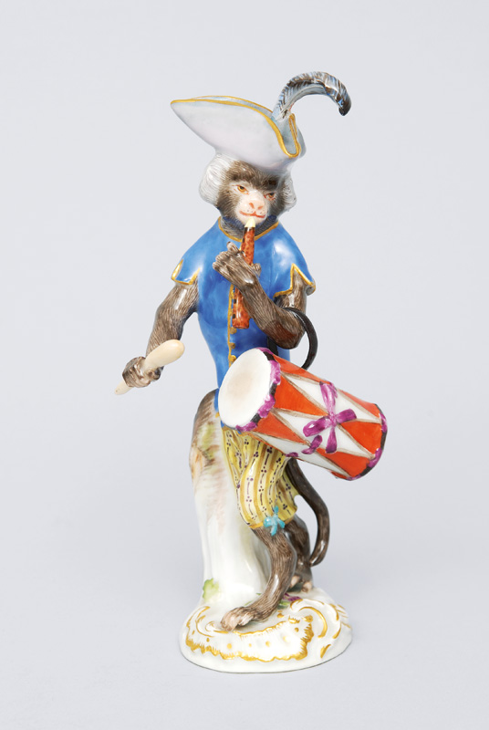 A figurine "drummer" of serial "music playing monkeys"