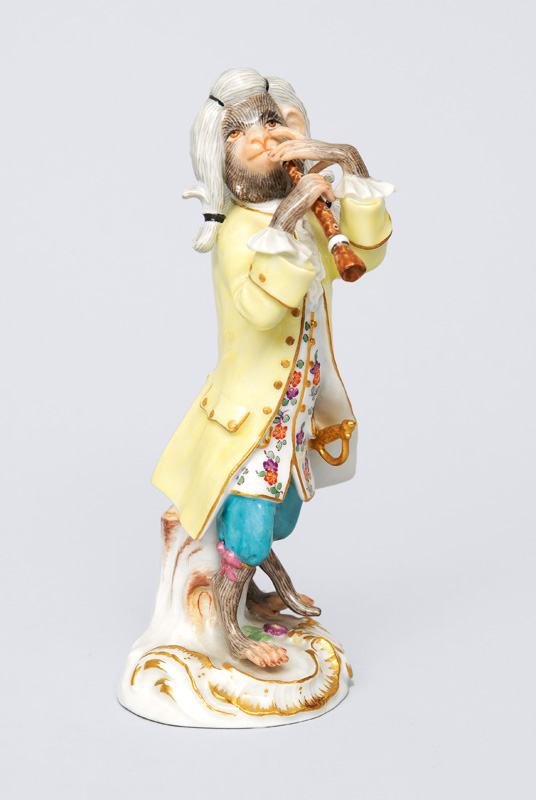 A figurine "clarinet player" of serial "music playing monkeys"