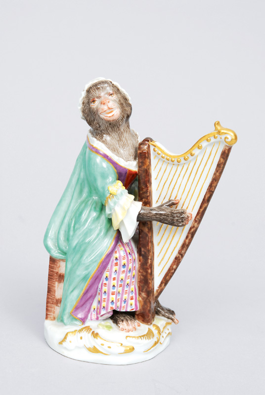 A figurine "female harp player" of serial "music playing monkeys"