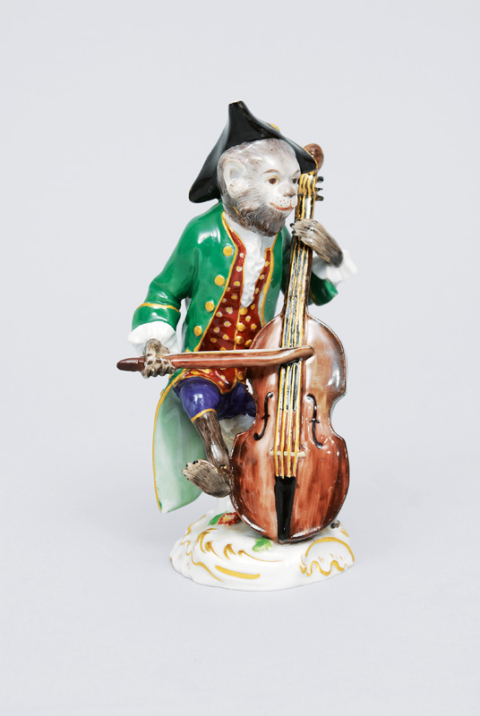 A figurineof "contrabass player" of serial "music playing monkeys"