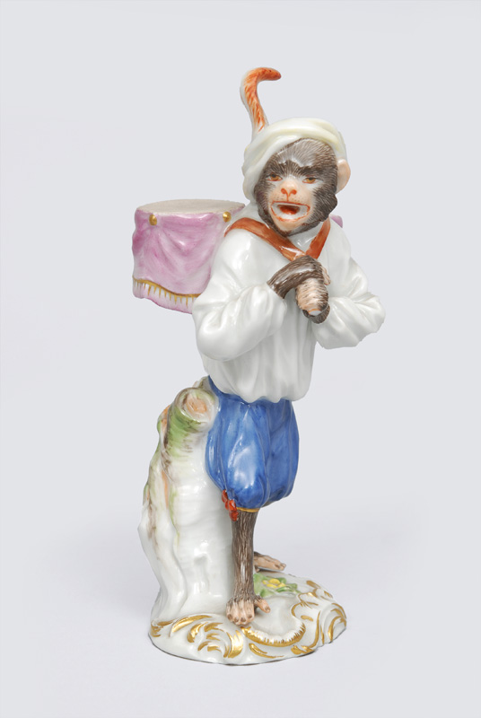 A figurine "kettle drum carrier" of serial "music playing monkeys"