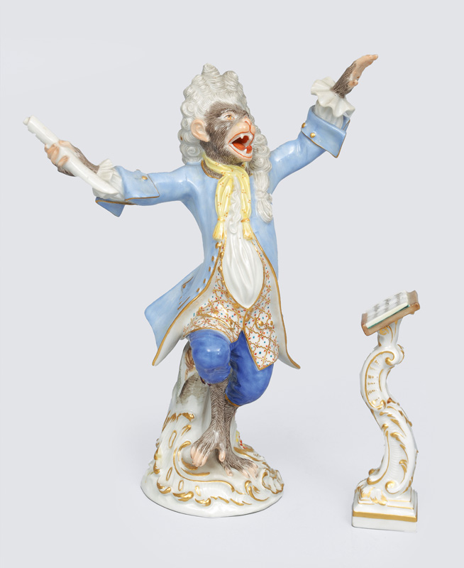 A figurine "chief conductor with music desk" of "music playing monkeys"