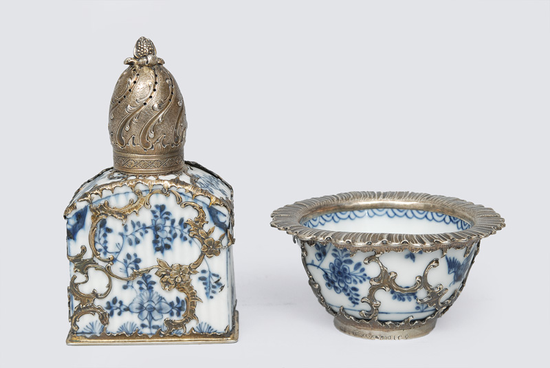 A spice shaker and tea bowl with blue painting and silver mounting