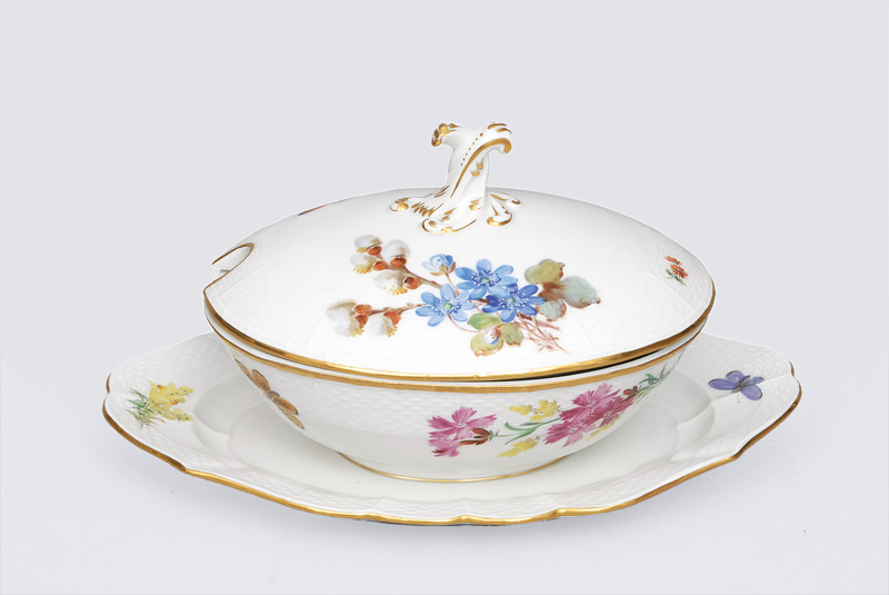 An oval tureen with bouquet and butterfly painting