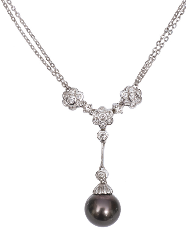 A petite pearl diamond necklace
