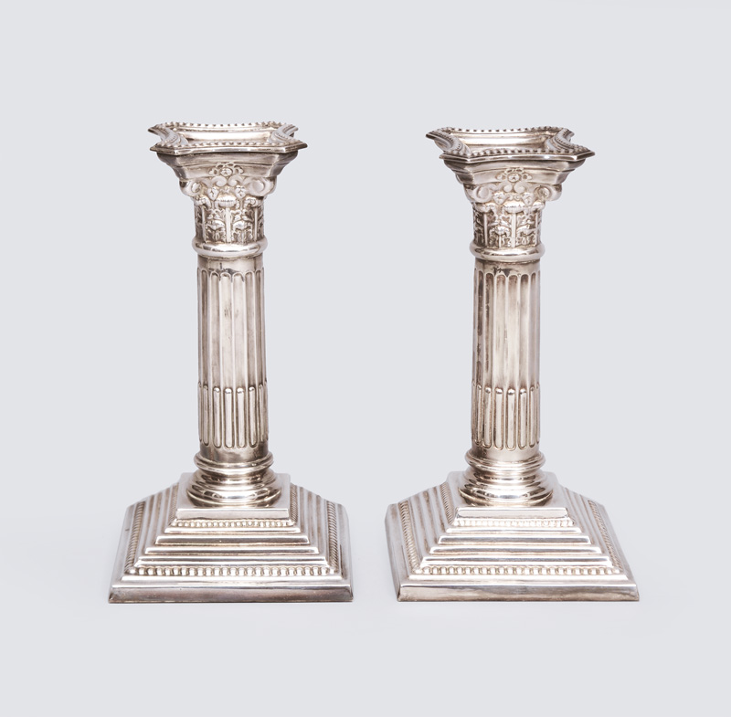 A pair of column-shaped candlesticks