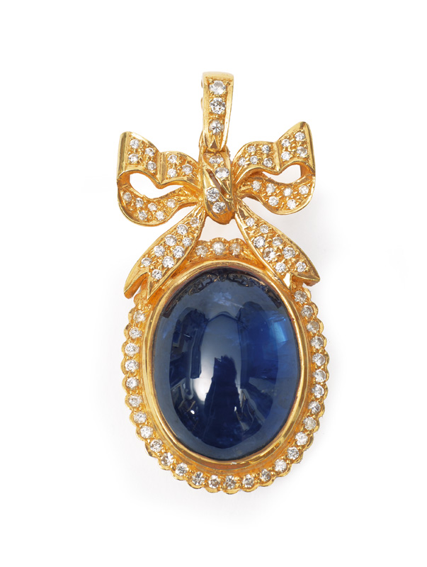 A sapphire diamond pendant with ornaments of bows