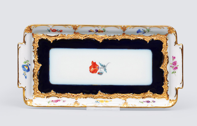 An oblong platter with flower sprays, cobalt blue ground and pomp decor