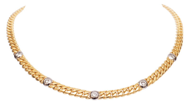 A golden necklace with diamonds