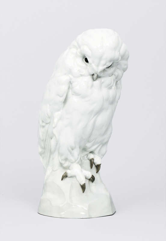 An imposing animal figurine "Snowy owl on rock base"