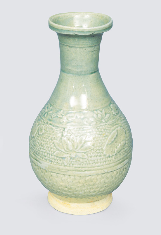 A celadon vase with floral decoration