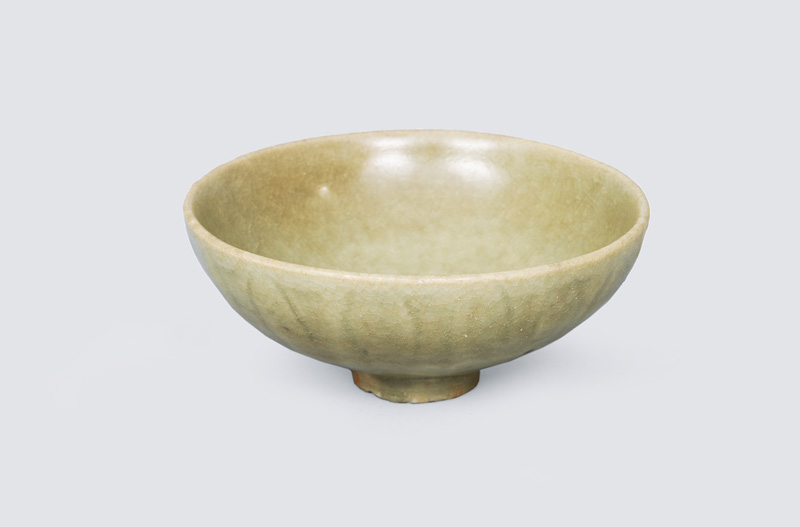 A small seladon bowl with lotus relief