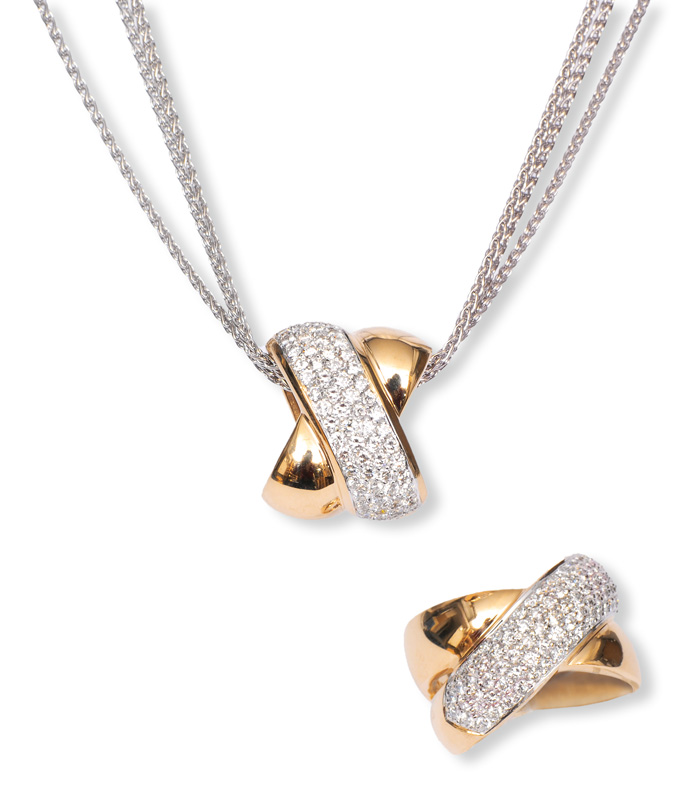 A diamond pendant with matching ring by jeweller Christ