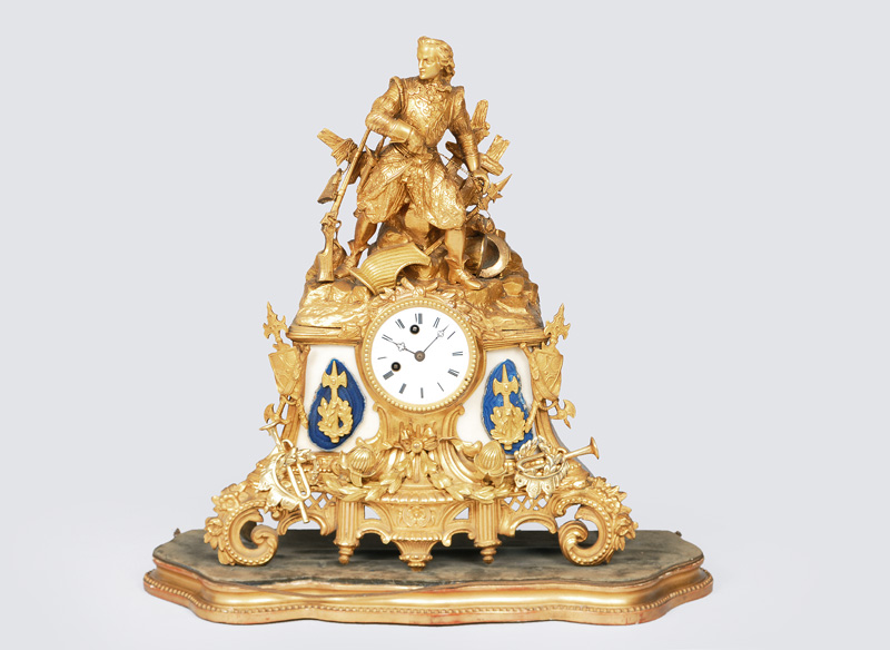 A mantle clock with figurative ornaments "Warrior"
