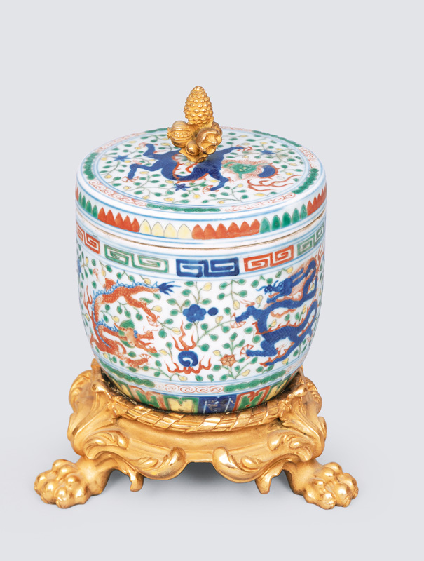 A bronze mounted jar with cover and dragon pattern