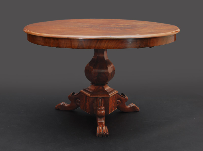 A Biedermeier table on claw-shaped feet