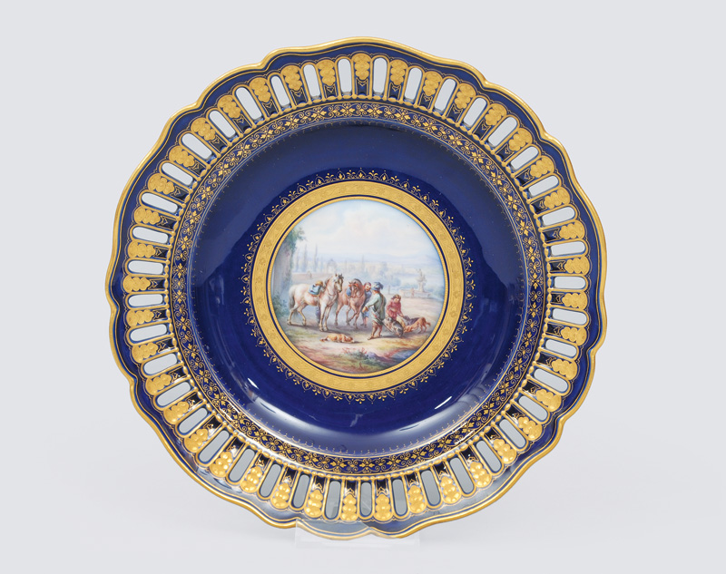 - An openwork plate with cobalt blue ground and a fine painted hunt scene An openwork plate with cobalt blue ground and a fine painted hunt scene