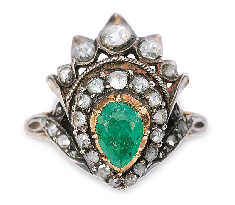 An emerald diamond ring