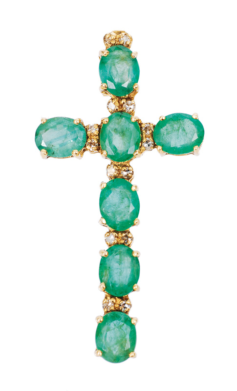 An emerald diamond cross pendant