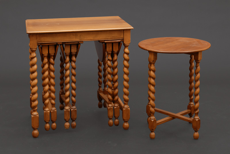 A side table with 4 small extending tables