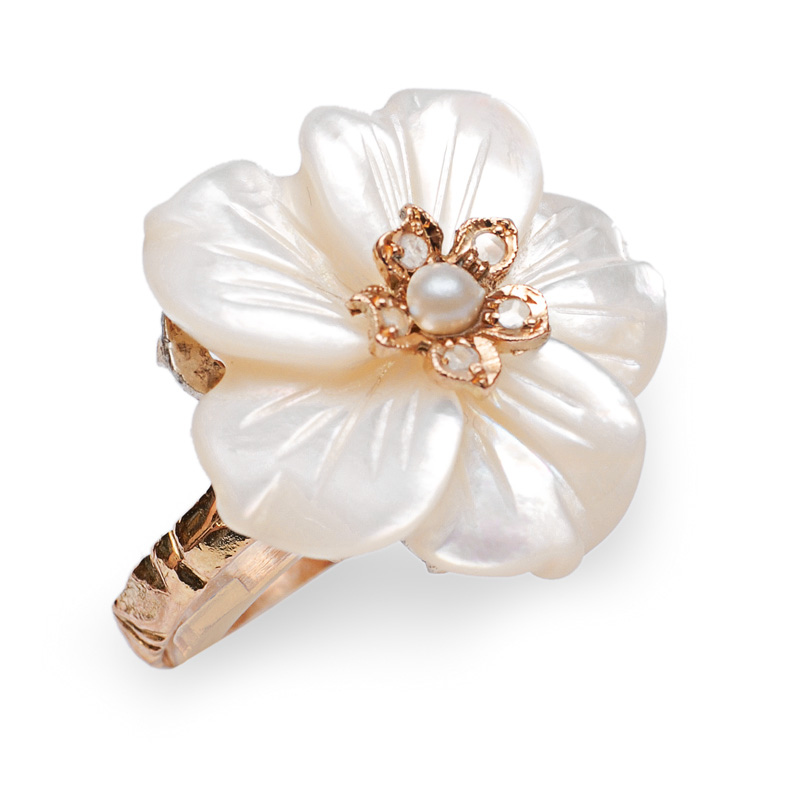 A mother of pearl ring in flower shape