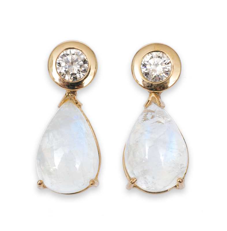 A pair of moonstone diamond earrings