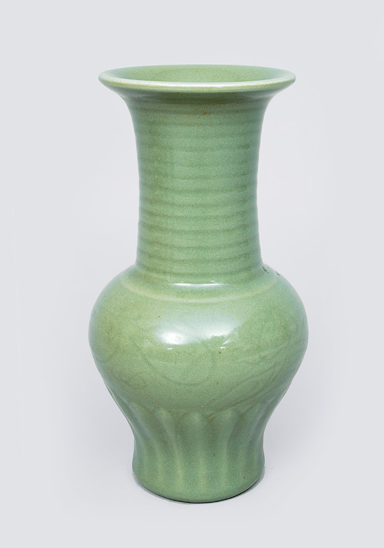A celadon vase with floral decoration