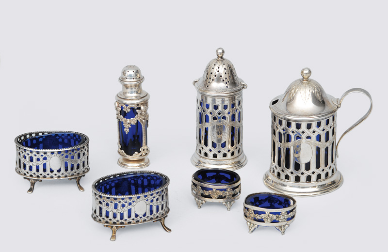 A set of 7 small spice pots with cobalt blue glass insert