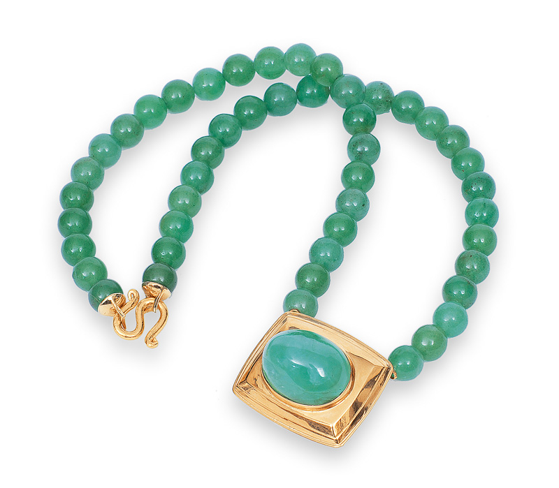 A jade necklace with lare cabochon pendant