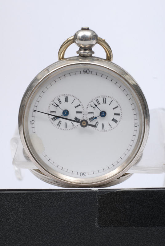 An open-face pocket watch with 2 time zones