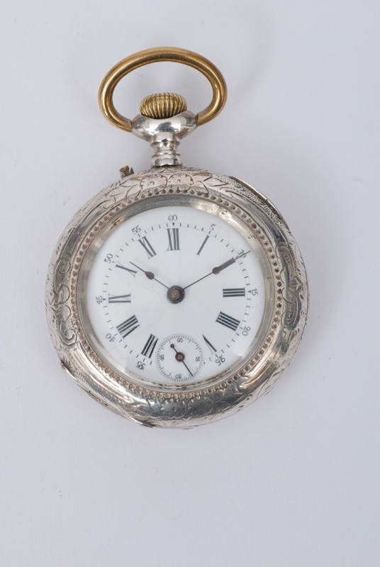 An open-face pocket watch with engraved case