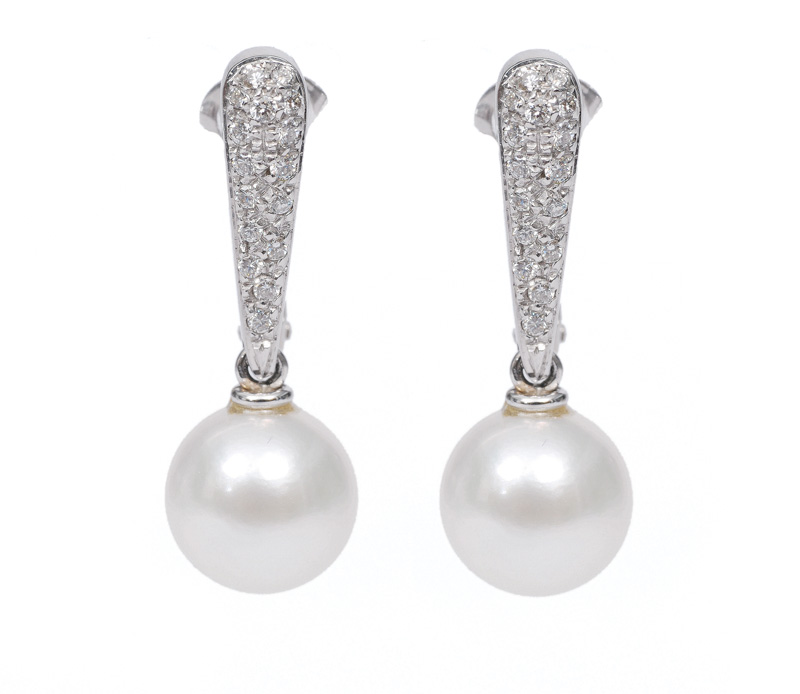 A pair of pearl diamond earrings