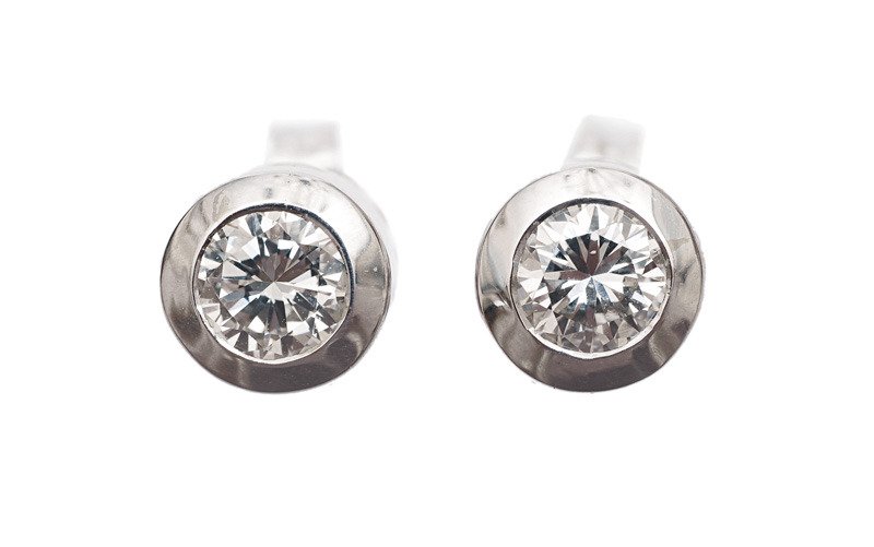 A pair of single stone diamond earstuds