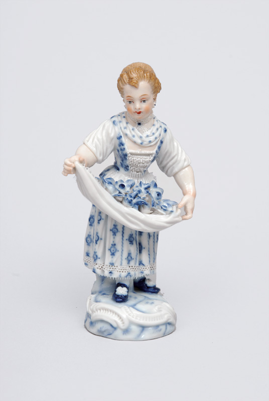 A figurine "Gardener"s child with flower pinafore"