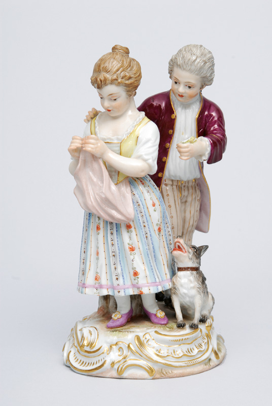 A figurine group "Persistent lover"
