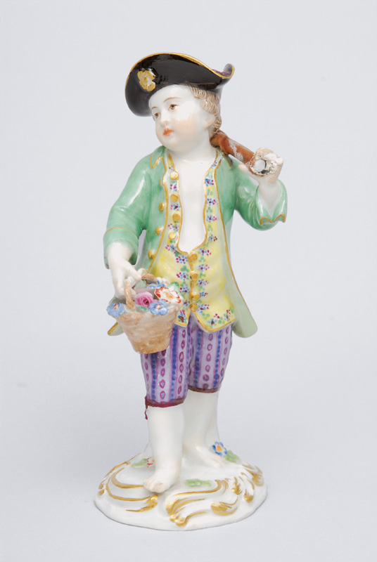 A figurine "Gardener"s child with hoe"