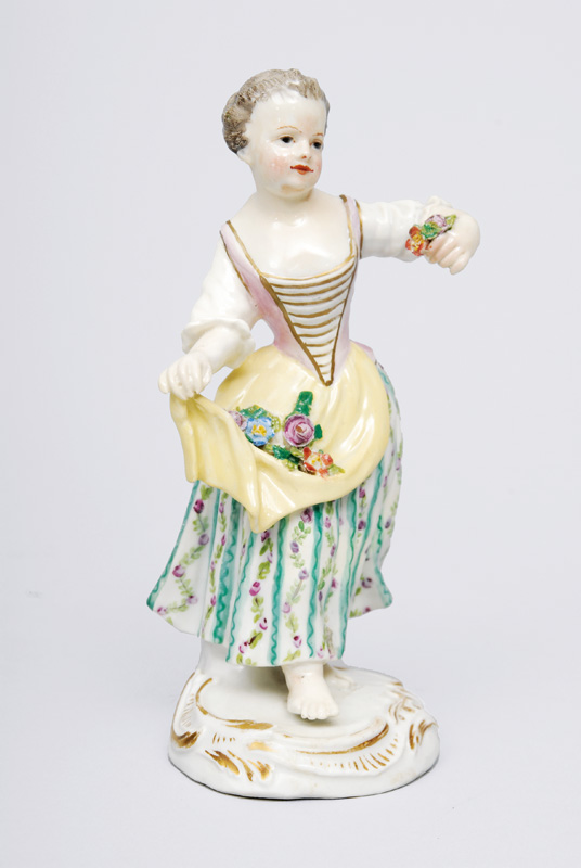 A figurine "Gardener"s child with flower pinafore"