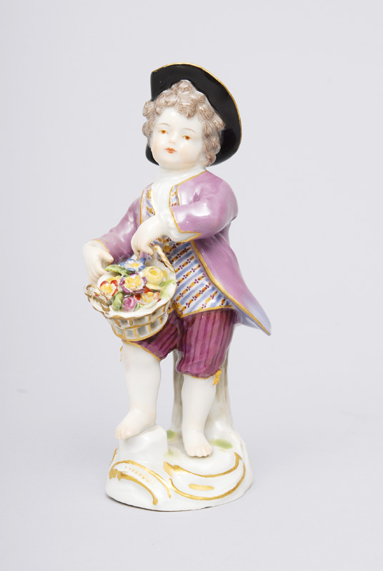 A figurine "Gardener"s child with flower basket"