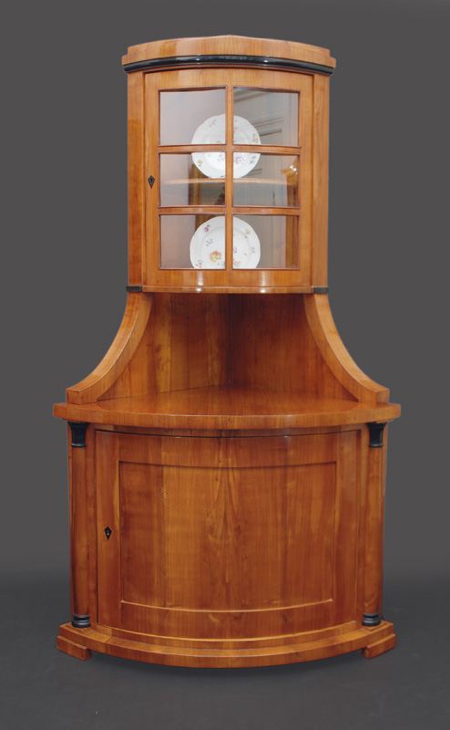A rare Biedermeier corner glass cabinet
