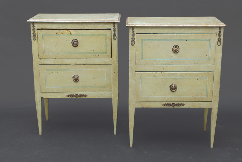 A pair of small coloured chest of drawers