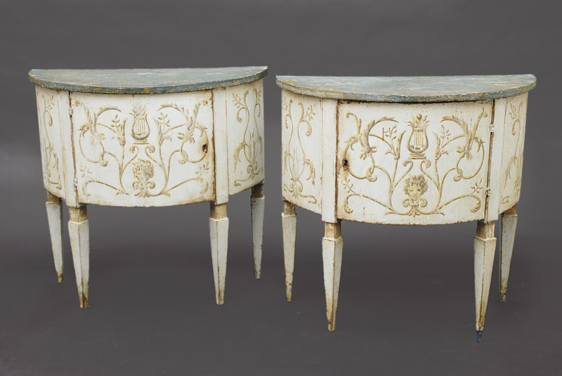 A pair of small Louis-Seize demi-lune cabinets