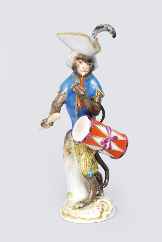A figurine "drummer" of serial "music playing monkeys"