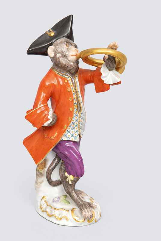 A figurine "french horn" of serial "music playing monkeys"