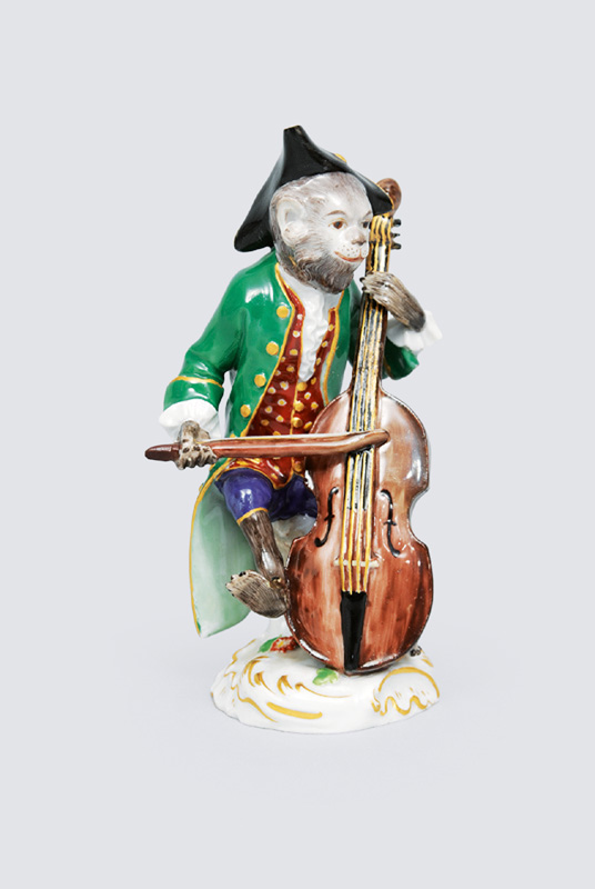 A figurineof "contrabass player" of serial "music playing monkeys"